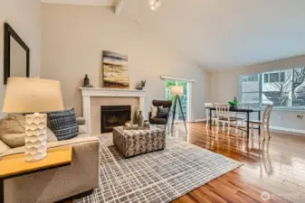 Living area looking to dining room and private backyard patio