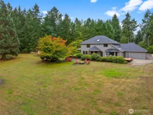 Property - Endless possibilities in this expansive backyard with a koi pond, greenhouse, chicken coop, and open space for play or entertaining. Perfect for family gatherings, gardening, or enjoying peaceful moments surrounded by nature.