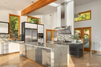 The kitchen enjoys great prep space, additional storage in the walk-in pantry.
