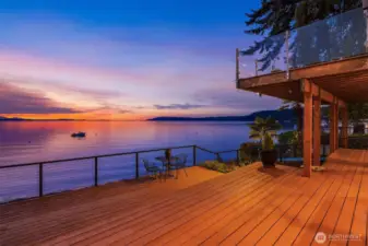 From this level, one enjoys a second tier of deck perfect for entertaining, sunbathing and lounging.