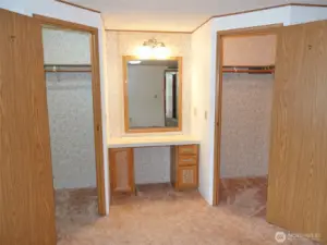 Master Bedroom vanity, and dual walk-in closets.