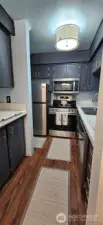 Galley style Kitchen with updated appliances