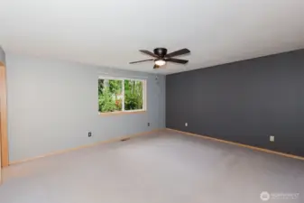 Primary bedroom with walk in closet and private bath