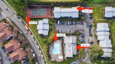 Aerial view of building G within the Highlands community, showing the pool, sports court, and clubhouse nearby.