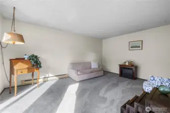 Living room with new carpet and a clean, open layout.