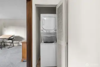 To the left of the stairs is the 2nd bedroom and washer and dryer.