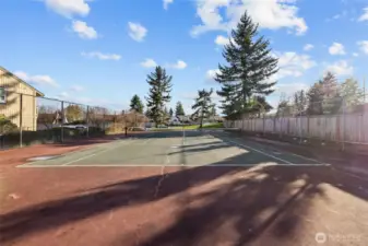 Residents only sport court with space for tennis, basketball, and play.