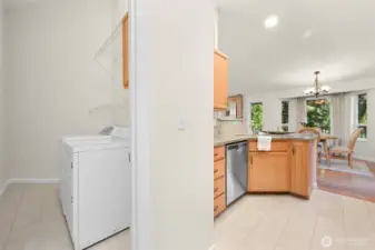 Designated laundry room with loads of storage.
