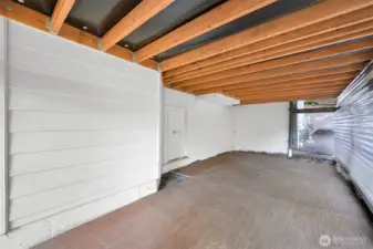 Covered and enclosed toy storage under deck.