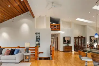 Peek a boo! Notice the loft attic space up top where there's more than 6ft of headroom. There's also many places to feature your artwork and collector items in this home. This is the view from the fireplace looking inward.