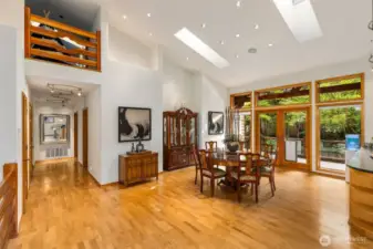 Closeup of the dining space (that table is huge, fits 8 chairs around), there's plenty of room for dinner parties, and loads of light pouring in from all angles.