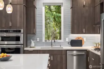 Slab stone counters, stainless appliances and a generous island.