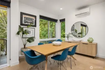 Dining area adjacent to large outdoor deck.