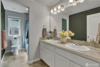 Main full bathroom upstairs with dual vanity