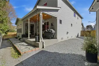 Low maintenance backyard with covered patio over looks the lush green belt