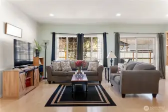 Living room with fenced back yard in the background