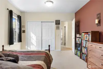 2nd bedroom, facing down the hall and Primary bedroom at the end, shared bathroom in the middle of the hallway