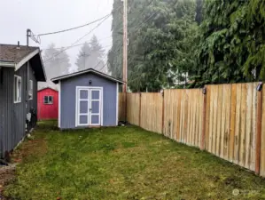 Fully fenced w/ 2 outbuildings.