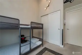 Closet has an organizer and the door to the right is into the hallway.