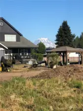 View of Mt. Rainier from backyard while installing new landscaping.  More fabulous views of the mountain from several rooms in the house and patio.