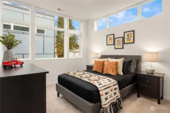 The third bedroom (3 located on the same floor) also features an abundance of windows and a spacious closet.