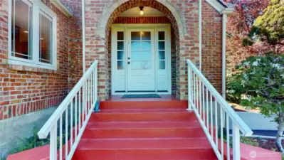 Steps to an arched entry greet your guests