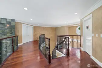 2nd floor landing, accentuated with the Iron Spindles and Brazilian Ironwood flooring!