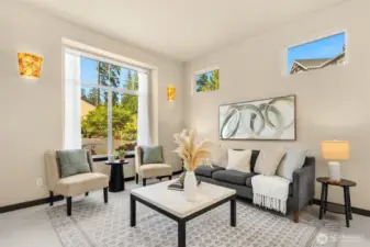 Formal living room with oversized windows.