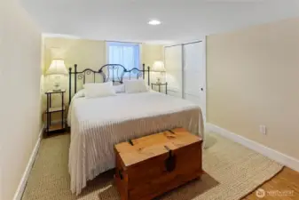 Lower level private bedroom.  Access to furnace room, water heater, and lower level storage here.