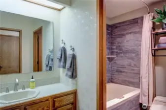Guest bathroom with full bath.