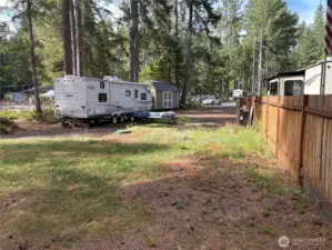 compltely fenced on the left side of the property