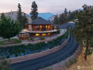 Paved driveway and extensive landscaping