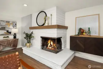 TV wiring is behind the picture on the floating shelf