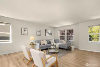 Oversized living room with new laminate wood flooring.