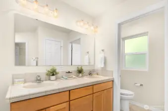 Primary bath with double vanity, walk-in closet and separate W/C.