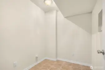 First floor storage room, craft room, space for a treadmill. You choose!