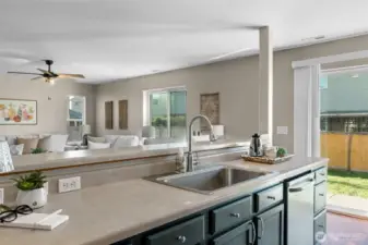 Kitchen looks out to living room