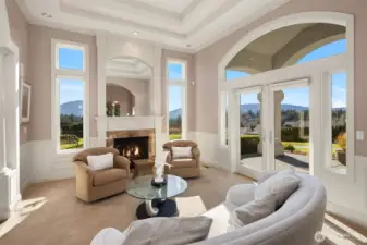 Mountain and City views from the living room that has its own covered patio on the west side of the home. Note the gas fireplace and the 12' high designer ceilings!