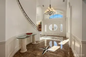 Top of the line finishes, Custom Staircase Railing and Substantial Light in the entry.