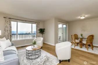 Living room facing the dining room and the kitchen is to the right of the dining room.
