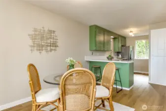 Dining room facing the kitchen. New floors, new quartz countertops and updated stainless steel appliances.