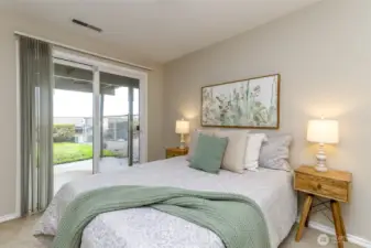 Downstairs extra bedroom with slider that leads out to the patio and the gate leading directly into the pool.