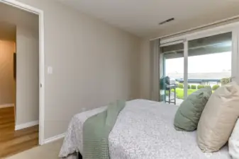 Here is another angle from the extra bedroom and sliding glass door to the outside lawn, patio and pool.