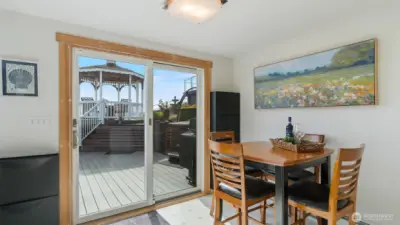 Dining room slider opens to the hot tub and gazebo