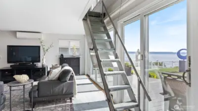 Pull-down staircase/ladder is used to access the loft bedroom