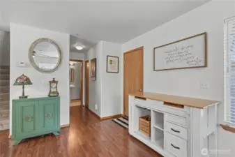 Garage door to the right.  Hall has a pantry closet and a coat closet for additional storage.