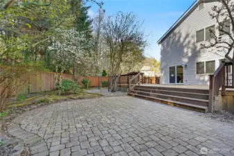 Updated patio work adjacent to the deck. Mature fruit trees in the yard.