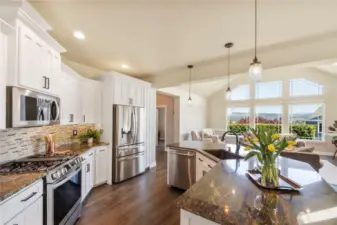 Your dream kitchen includes a French double door fridge with ice & water, gas cookstove with griddle, updated appliances & that breathtaking view.