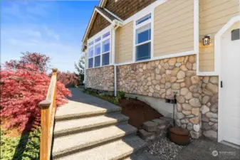 Lovingly maintained with fresh exterior paint in 2017. The wide aggregate steps lead to your covered porch.