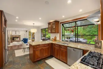 Open kitchen adjoins the family room/den.
